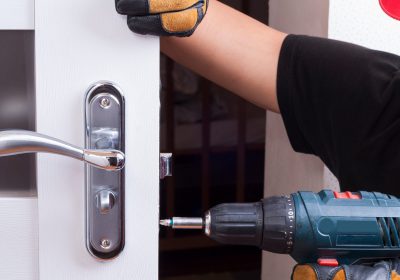 Close-up Of Person's Hand Opening Car Door With Lockpicker